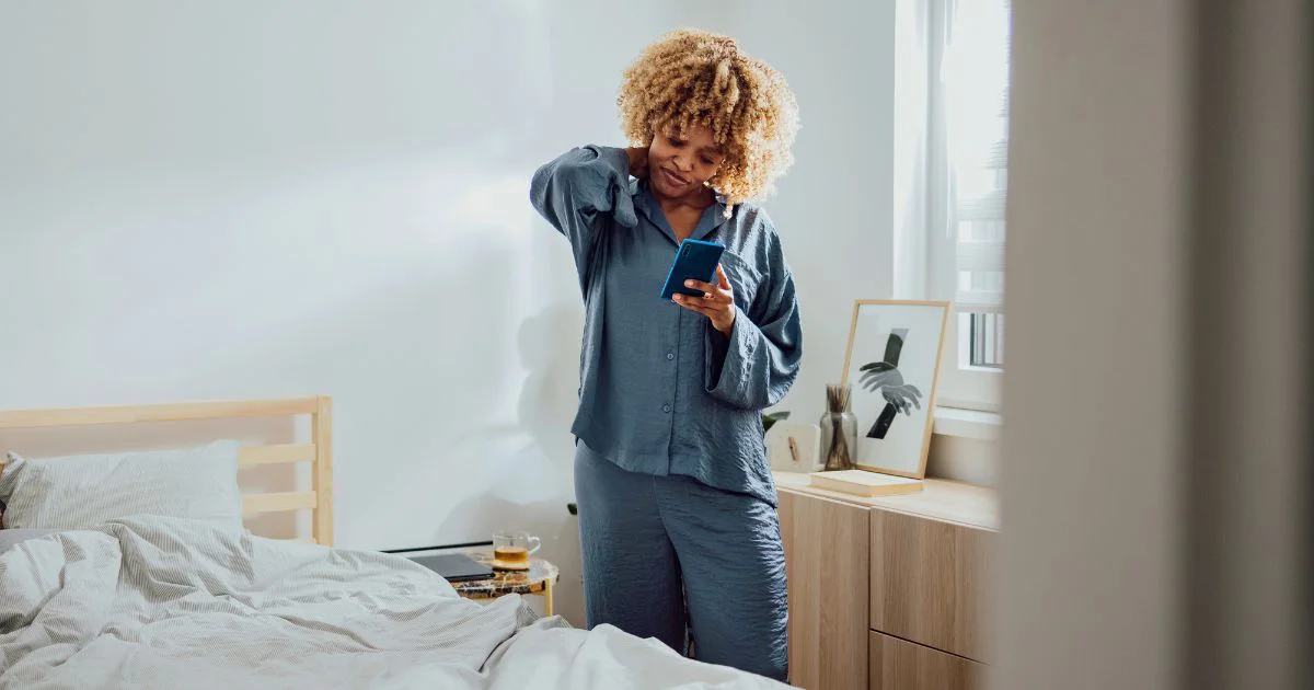 Woman looking down at phone.