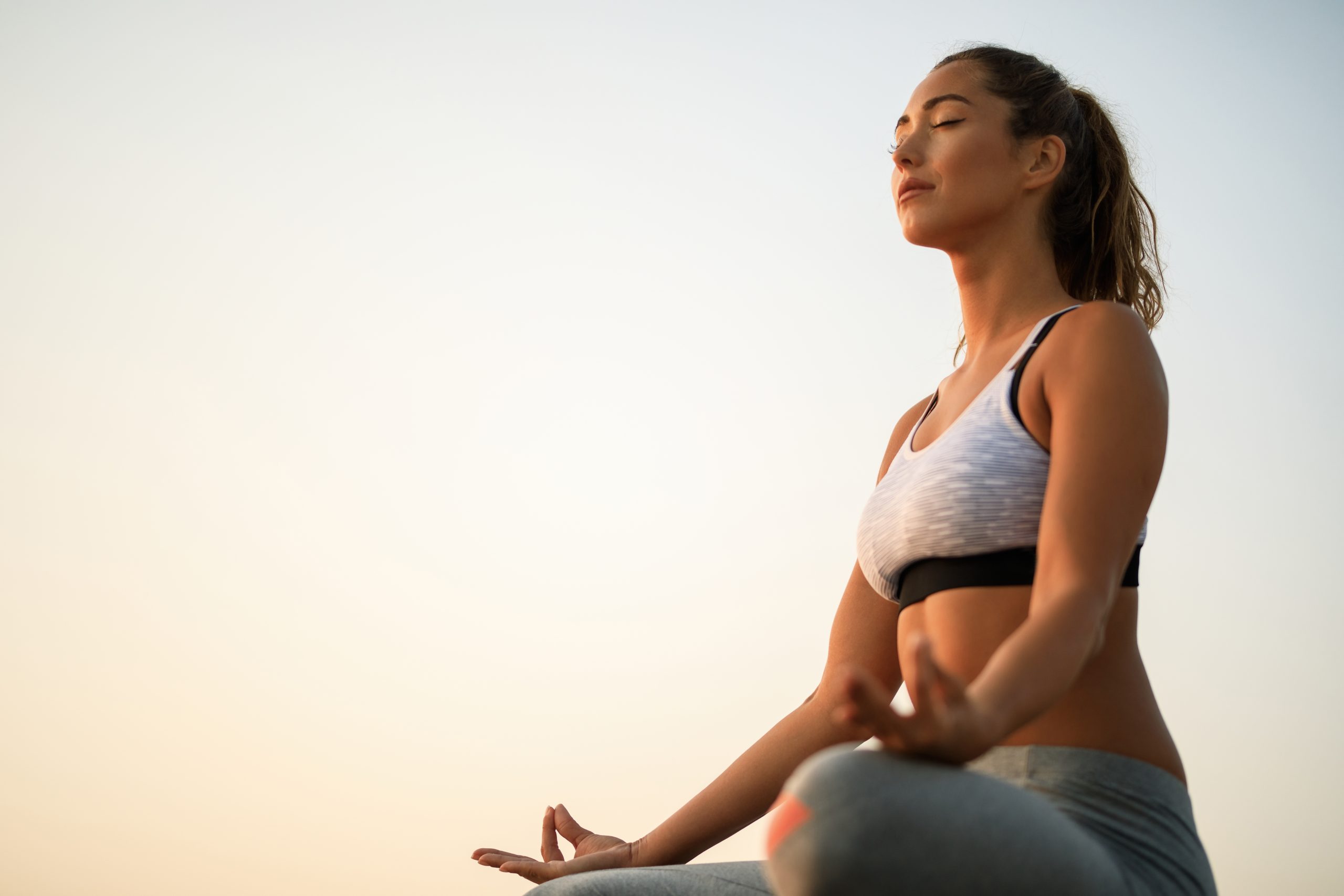 A woman inhaling peacefully